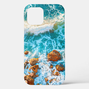 Waves on a rocky beach at sunset. Aerial viewbeach iPhone 12 Case