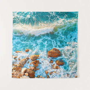 Waves on a rocky beach at sunset. Aerial viewbeach Tapestry