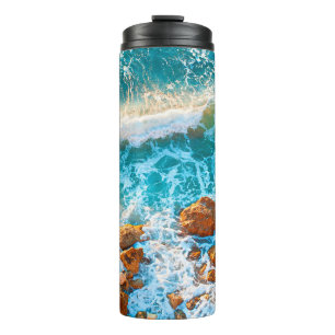 Waves on a rocky beach at sunset. Aerial viewbeach Thermal Tumbler