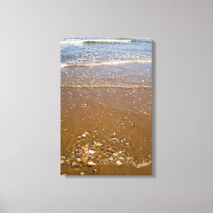 Waves Splashing Against Pebbles on a Beach Canvas Print