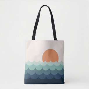 Wavy blue ocean at sunset tote bag