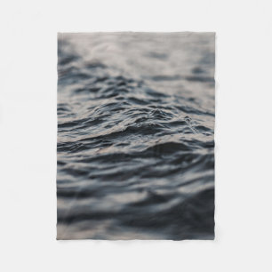 Wavy ocean during daytime fleece blanket