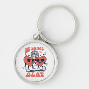 we dance to the same beat key ring
