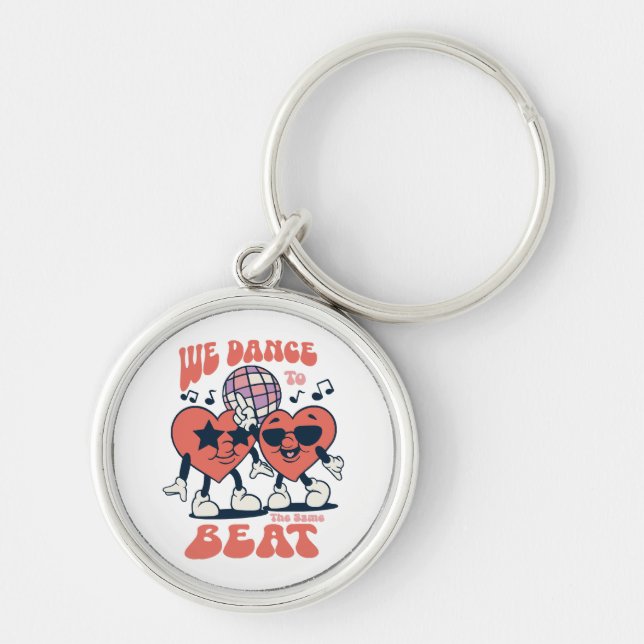 we dance to the same beat key ring (Front)