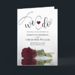 We Do Elegant Burgundy Rose Folded Wedding Programme<br><div class="desc">Make it easy for your guests to follow along with the ceremony with these beautiful folded wedding programs. The design features a stunning and romantic design with a single long stemmed burgundy, maroon, or wine red coloured rose lying on its side mirrored in a pool of water. There is modern...</div>