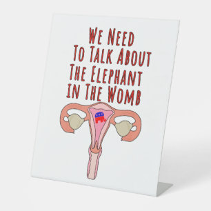 We Need to Talk About The Elephant In The Womb Pedestal Sign