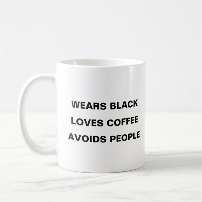 Wears black, loves coffee, avoids people coffee mug (Left)
