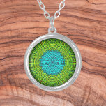 Weave Mandala Blue and Green Silver Plated Necklace<br><div class="desc">This funky mandala features green and blue in a patchwork,  woven thread style. Psychedelic visuals for the modern hippie or anyone who loves groovy colours.</div>