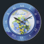 Wedding Anniversary Blue Sapphire Roman Numerals Large Clock<br><div class="desc">A lovely clock in blue sapphire tones, with Roman numerals. The frame that functions as part of the clock is also a frame for your favourite wedding photograph. Keep the sample image of blue, yellow and green Spring floral bouquet, or replace it with your own image for full personalisation. Add...</div>