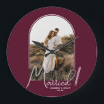 Wedding Arch Photo Burgundy Large Clock<br><div class="desc">A special keepsake features your wedding photo in an elegant arch design with the text "Married" in chic lettering along with your names and wedding date on a burgundy background small or large wall clock. Beautiful gift for your family and a fabulous memory to display in your own home. BACKGROUND...</div>