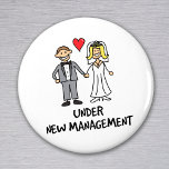 Wedding Couple - Under New Management Magnet<br><div class="desc">A cute cartoon of a newlywed couple captioned 'under new management'. Is it the bride or groom that wears the trousers in the marriage? Great for a wedding gift,  or to wear on honeymoon.</div>