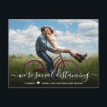 Wedding Date Postponed Simple Photo Announcement Postcard<br><div class="desc">Event postponed announcement template - simple photo change of date postcard. Modern Unsave the Date Photo postcard with full horizontal photo. Feature an elegant handwritten typography design with text „we're social distancing” and one vertical photo you can change it easily. #3339 If you need help or matching items, please contact...</div>