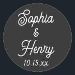 Wedding Elegant Script Modern Typography Black Classic Round Sticker<br><div class="desc">These elegant script modern typography black and white stickers are perfect to use for any of your wedding events!  Personalise with the bride and groom names and wedding date.  The background colour can be changed to fit your preference.</div>