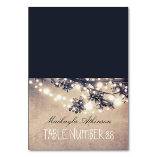 wedding escort cards string lights branches