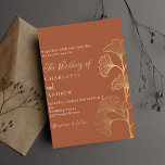 Wedding ginkgo leaves terracotta brown gold invitation<br><div class="desc">A trendy terracotta,  dusty earth coloured background decorated with simple golden ginkgo leaves. Personalise and add your names and the details.</div>