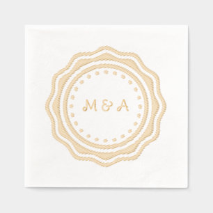 Wedding napkin with golden monogram.