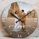 Wedding Photo Love Script Anniversary<br><div class="desc">Celebrate love with our personalised wedding photo love script anniversary round clock,  which features an elegant script and chic modern design. This personalised photo clock beautifully displays your favourite wedding photo,  making it a timeless keepsake for newlyweds or a thoughtful wedding anniversary gift!</div>