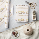 Wedding Ring Set Wedding Congratulations  Wrapping Paper<br><div class="desc">A beautiful set of the bride and groom's wedding rings on slight tan with gold lettering

Text says "Congratulations on your wedding day!"</div>