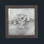 Wedding Rings on Grey Will You Marry Me Gift Box<br><div class="desc">Propose to your girlfriend and ask her to marry you with the pretty Will You Marry Me Engagement Ring Box. Personalised it with her name, if desired. Please change the text or font to suit your proposal needs. This elegant engagement gift box features a digitally enhanced photograph of a diamond...</div>