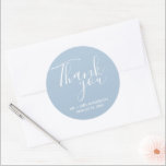 Wedding Thank You Blue Wedding Favour Classic Round Sticker<br><div class="desc">Wedding favour stickers in blue and white. Say thank you to your wedding guests with these personalised wedding stickers in a gorgeous script font that read: Thank you. Personalise with your names and wedding date. The background colour of these stickers can be changed to colour of your choice by contacting...</div>