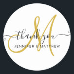 Wedding Thank You Elegant Script Gold White Classic Round Sticker<br><div class="desc">Wedding Thank You Elegant Typography Chic Gold Black White Minimal Classic Monogram Script Design © Elke Clarke Perfect for wedding favours,  thank you card envelope seals,  bridal shower favour bags and engagement party thank you envelope seals.</div>