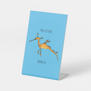 Weedy seadragon cartoon illustration   pedestal sign