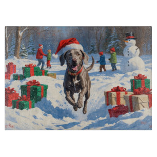 Weimaraner Running in Snow with Christmas Hat Cutting Board