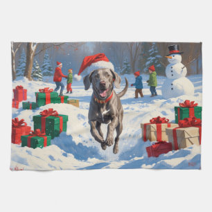 Weimaraner Running in Snow with Christmas Hat Tea Towel