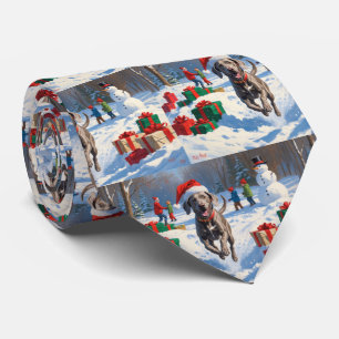 Weimaraner Running in Snow with Christmas Hat Tie