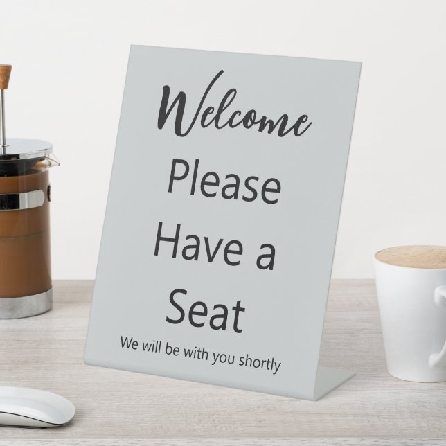 Welcome Please Have a Seat Grey and Black Text Pedestal Sign (In SItu)