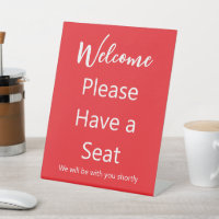 Welcome Please Have a Seat Red and White Text