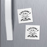 Welcome to the Cabin | Rustic Arrows & Pine Tree Magnet<br><div class="desc">Remind your guests (and yourself) that it's time to kick back and relax with this cute rustic-style fridge magnet. Design features "Welcome to the Cabin" in black sandblasted typography with a rope illustration,  pine trees and crossed arrows. Customise with your year established.</div>