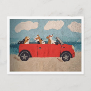 Welsh Corgis in a red convertible at the beach Postcard