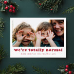 We're Totally Normal Funny Family Photo Christmas Holiday Card<br><div class="desc">Capture the joy and humour of the season with this playful "We're Totally Normal" Christmas card. Featuring a candid family photo, this design embraces the funny, silly moments that make your family unique. The modern red text and simple layout offer a charming yet humourous touch, making this card perfect for...</div>