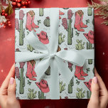Western Howdy Christmas Cowgirl Wrapping Paper<br><div class="desc">This fun and festive Western Howdy Christmas Cowgirl wrapping paper features hand-drawn illustrations of Xmas cowgirl boots,  hats,  mittens,  cacti,  holly berries and stars. All against an elegant blue background.</div>