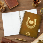 Western Theme Horseshoe Brown & Gold Monogram Planner<br><div class="desc">This unique planner features a simple brown,  aged leather-look background with a faux gold horseshoe and heart. A monogram of initials completes the design. Perfect for the western,  cowboy,  or horse lover in your family. Created by Simply Farmhouse Press.</div>