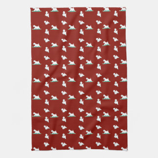 Westie on red tea towel