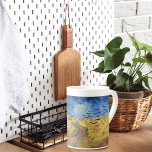 Wheatfield with Crows by Van Gogh Bone China Mug<br><div class="desc">A fine art Bone China Mug with the painting Wheatfield with Crows (1890) by Vincent van Gogh (1853-1890). A contemplative representation of a wheat field with a meandering dirt path under a vast blue sky, is adorned with a haunting flock of crows. His expressive brushstrokes and bold color choices bring...</div>