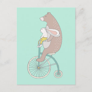 Whimsical Bunny and Bear Riding a Bike Postcard