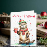 Whimsical Christmas Otter with Festive Hat  Card<br><div class="desc">This delightful Christmas greeting card features an adorable otter standing upright, dressed in a festive red and green striped hat with a fluffy pom-pom and a cosy red scarf with white fringe. The otter holds a red cup adorned with a white snowflake design, filled with a whipped cream-topped beverage. Above...</div>