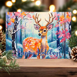 Whimsical Deer in Forest Cute Christmas Holiday Card<br><div class="desc">Send holiday cheer with this enchanting Christmas card featuring a whimsical deer in a colourful forest. The vibrant scene showcases the deer surrounded by snowy trees and bright foliage, complemented by a cheerful "Happy Holidays" greeting in blue. This delightful design is perfect for nature lovers and anyone who enjoys a...</div>
