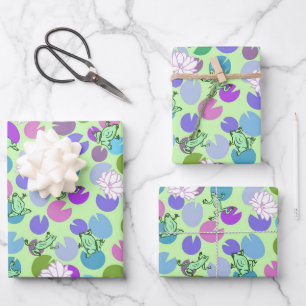 Whimsical green frogs and lily pads on mint green wrapping paper sheet