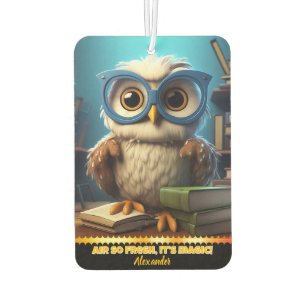 Whimsical owl with glasses in a cosy library nook car air freshener