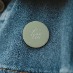 Whimsical Sage Green Gender Reveal Team Boy<br><div class="desc">Introducing our whimsical sage green gender reveal team boy button, perfect for your simple modern boho celebration any season of the year! This button has a boho-chic, gender-neutral vibe with elegant calligraphy and a delicate minimalist design, making it ideal for both girls and boys. Plus, it's editable, so you can...</div>