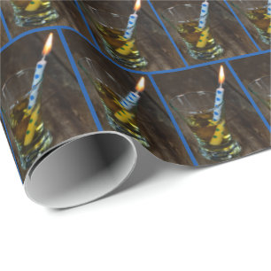 Whiskey glass with birthday candle wrapping paper