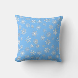 White 3-d snowflakes on an ice blue background cushion