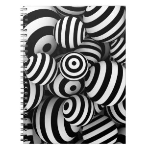 White abstract background with balls and black lin notebook