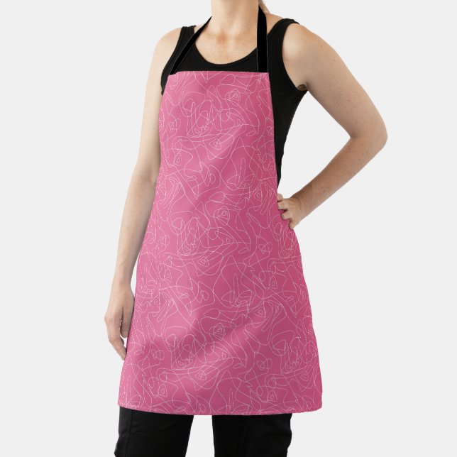 White abstract doodles on pink background apron (Insitu)