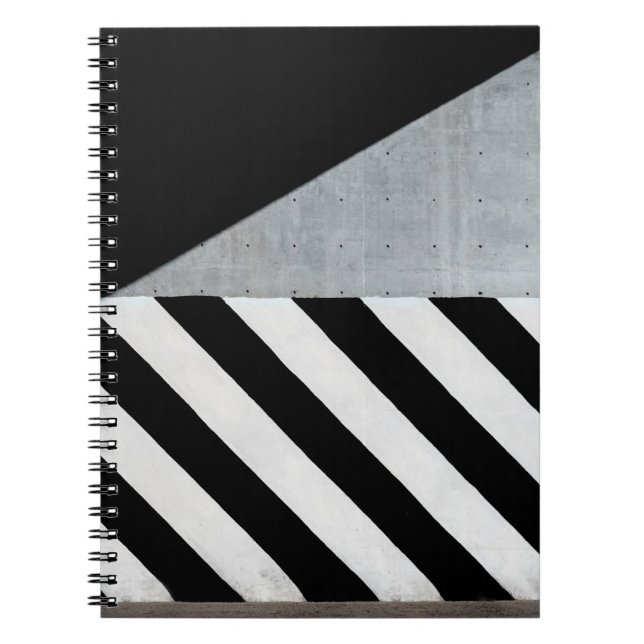 White and black diagonal striped paint on wall notebook (Front)