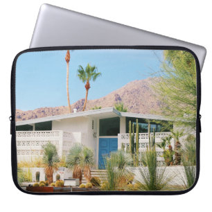 WHITE AND BLUE CONCRETE BUILDING NEAR GREEN TREES LAPTOP SLEEVE